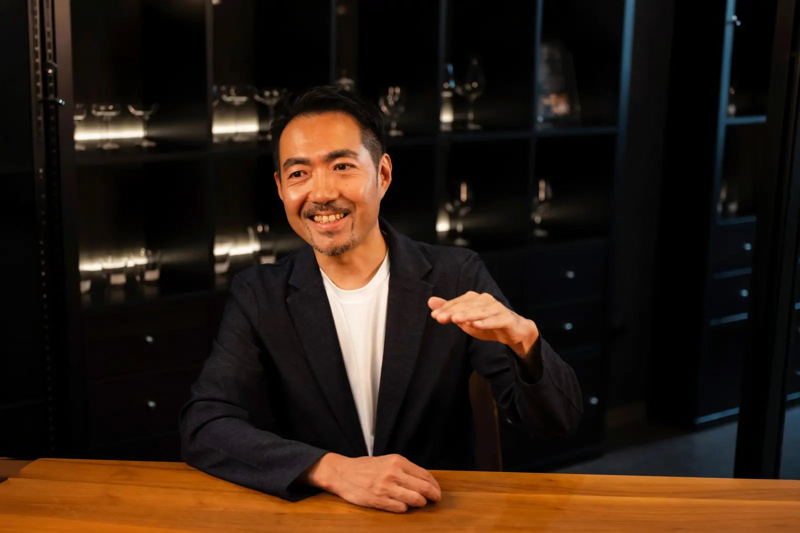 Yusuke Nomiya seated at a table