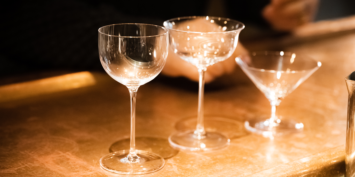 SIP AND GUZZLE VANDYKE stemmed glasses on a bar counter
