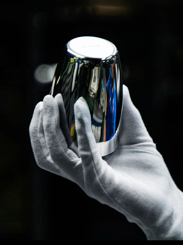 Checking a polished stainless-steel vessel by hand